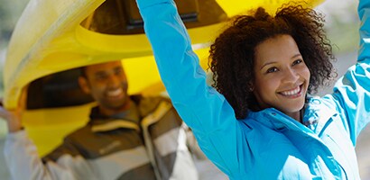 Couple Carrying Kayak
